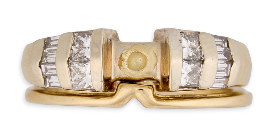 Set of 14K Diamond Stacking Rings: Two 14K yellow gold stacking rings, one ring featuring diamond details, both marked "14K"Size: 5 Total weight: 4.8 gProvenance: Property from a home in San Antonio, Texas