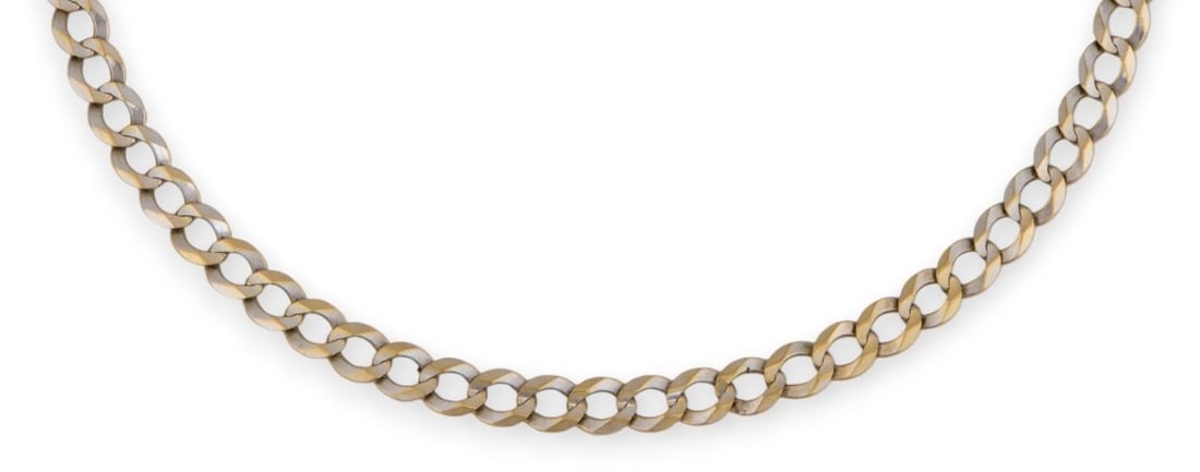 10K Curb Chain: 10K white gold curb chain necklace, with sterling silver clasp, chain marked "10K" and clasp marked "925"Length: 21 in. Total weight: 15.0 gProvenance: Property from a North San