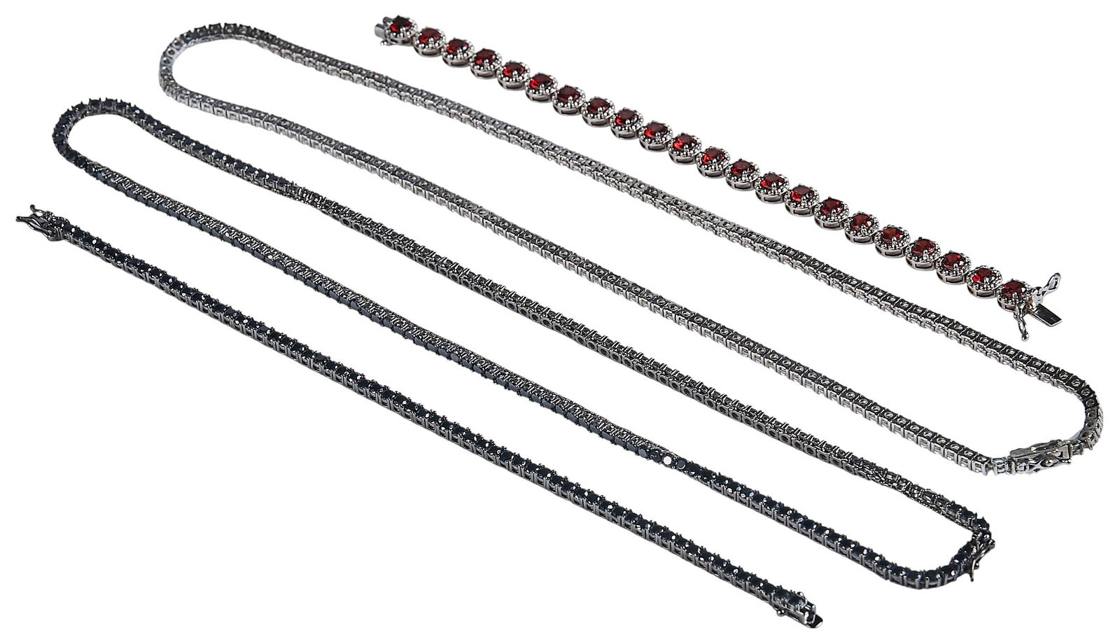 (4) Sterling Silver Jewelry: Collection of sterling silver chain jewelry, with two necklaces, and two bracelets, all marked "925"Length: 20 in. / longest Total weight: 2.335 oztProvenance: Property from a North San