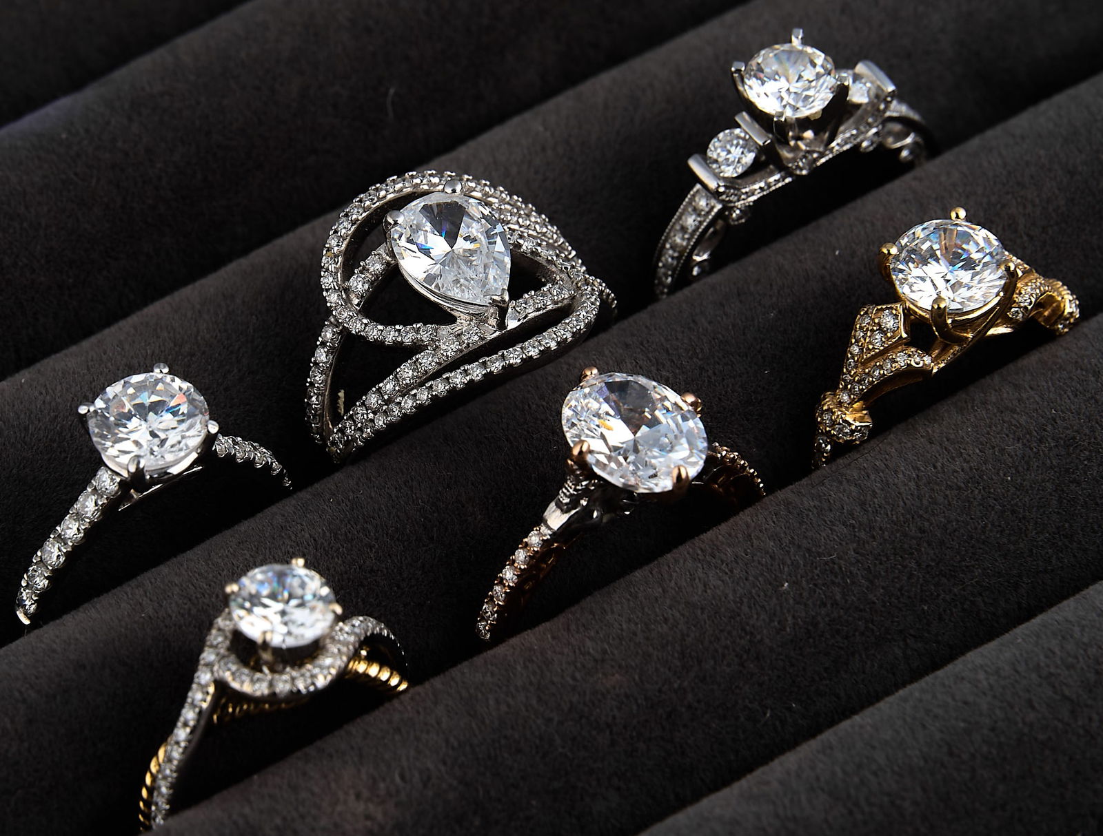 (6) Engagement Ring Settings: Six engagement ring settings, five 14K and one 18K, with cubic zirconia center stones, all marked "14K" or "18K"Total weight: 28.4 gProvenance: Property from a North San Antonio,