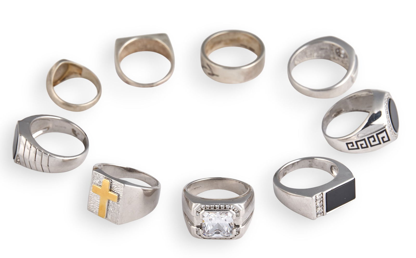 (9) Sterling Silver Men's Rings: Nine men's sterling silver rings, in assorted sizes and styles, all marked "925" or "Sterling"Total weight: 2.31 oztProvenance: Property from a North San Antonio, Texas