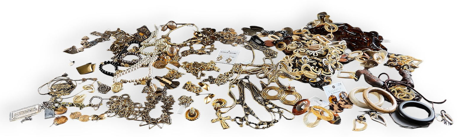 Assorted Collection of Costume Jewelry: Large collection of costume jewelry including necklaces, earrings, bracelets, and brooches, with various styles and materials are present, including gold-tone, silver-tone, pearls, and