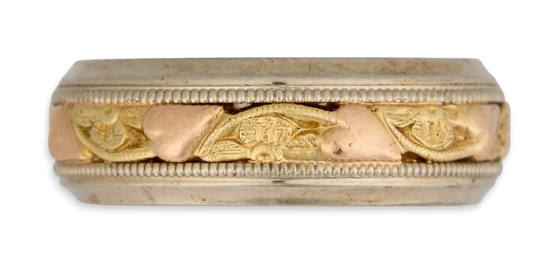 14K Wedding Band: 14K two-tone gold wedding band, with engraved details, marked "14K Size: 6.25Total weight: 6.15 g Provenance: Property from a home in San Antonio, Texas