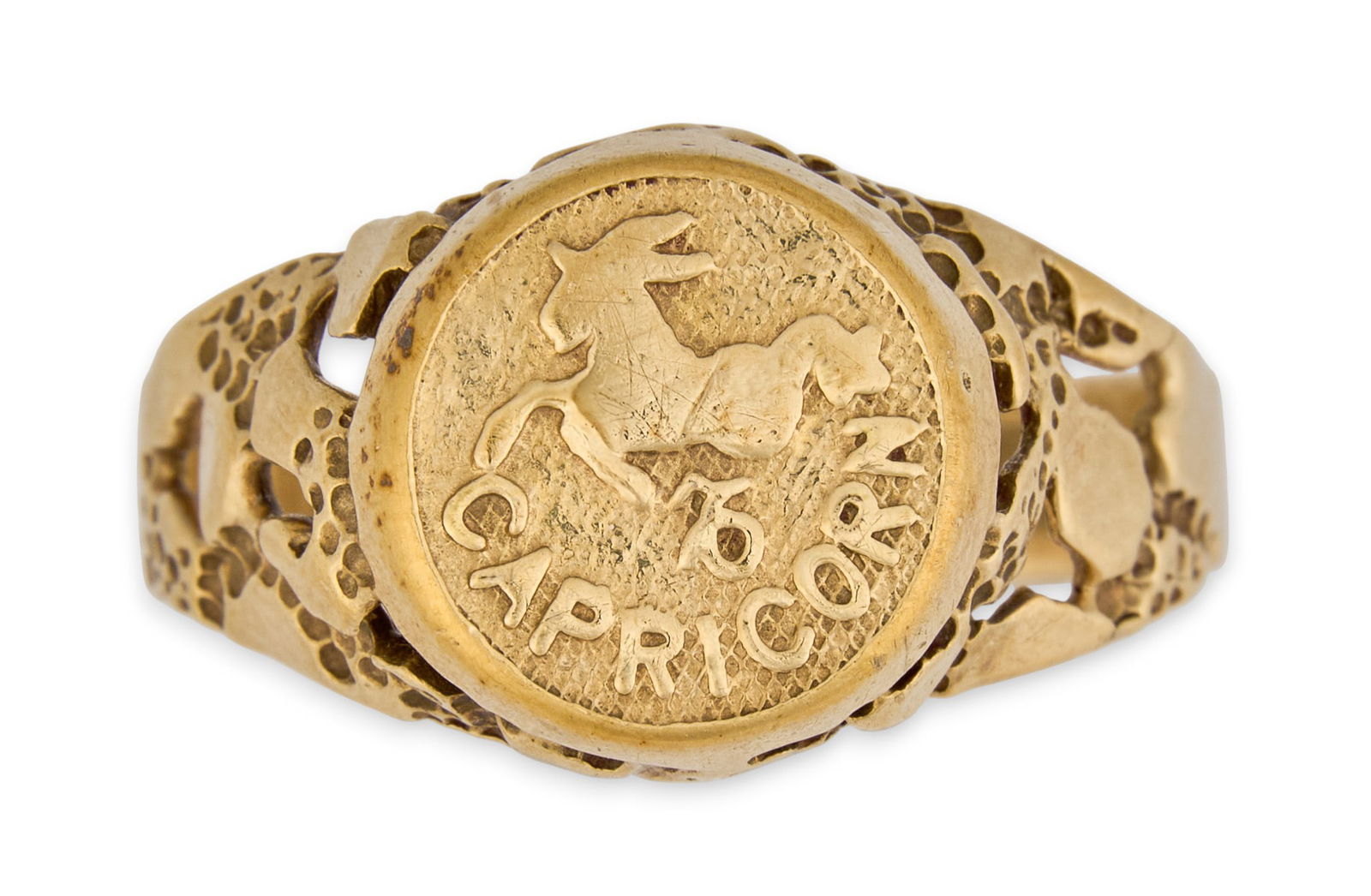 10K Capricorn Gent's Ring: 10K yellow gold (tested) gentlemen's ring with Capricorn astrological imagery, and punched details Size: 15Total weight: 6.4 g Provenance: Property from a home in San Antonio, Texas