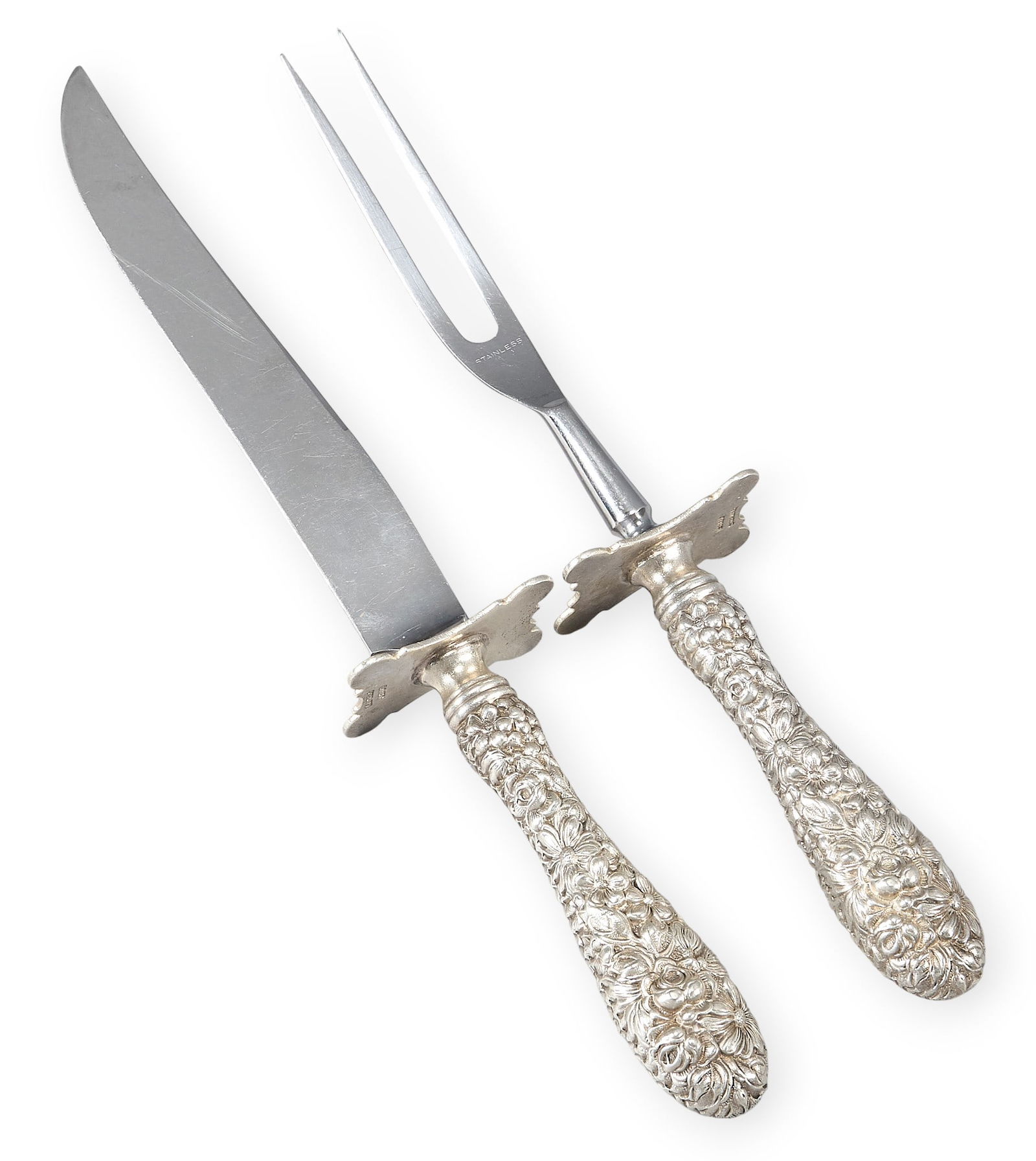 (2) Sterling Silver Repousse Carving Set: Two-piece repousse sterling silver carving set, no monogram or removal, stainless bladesTotal weight: 2.0 oztProvenance: Property from a home in San Antonio, Texas