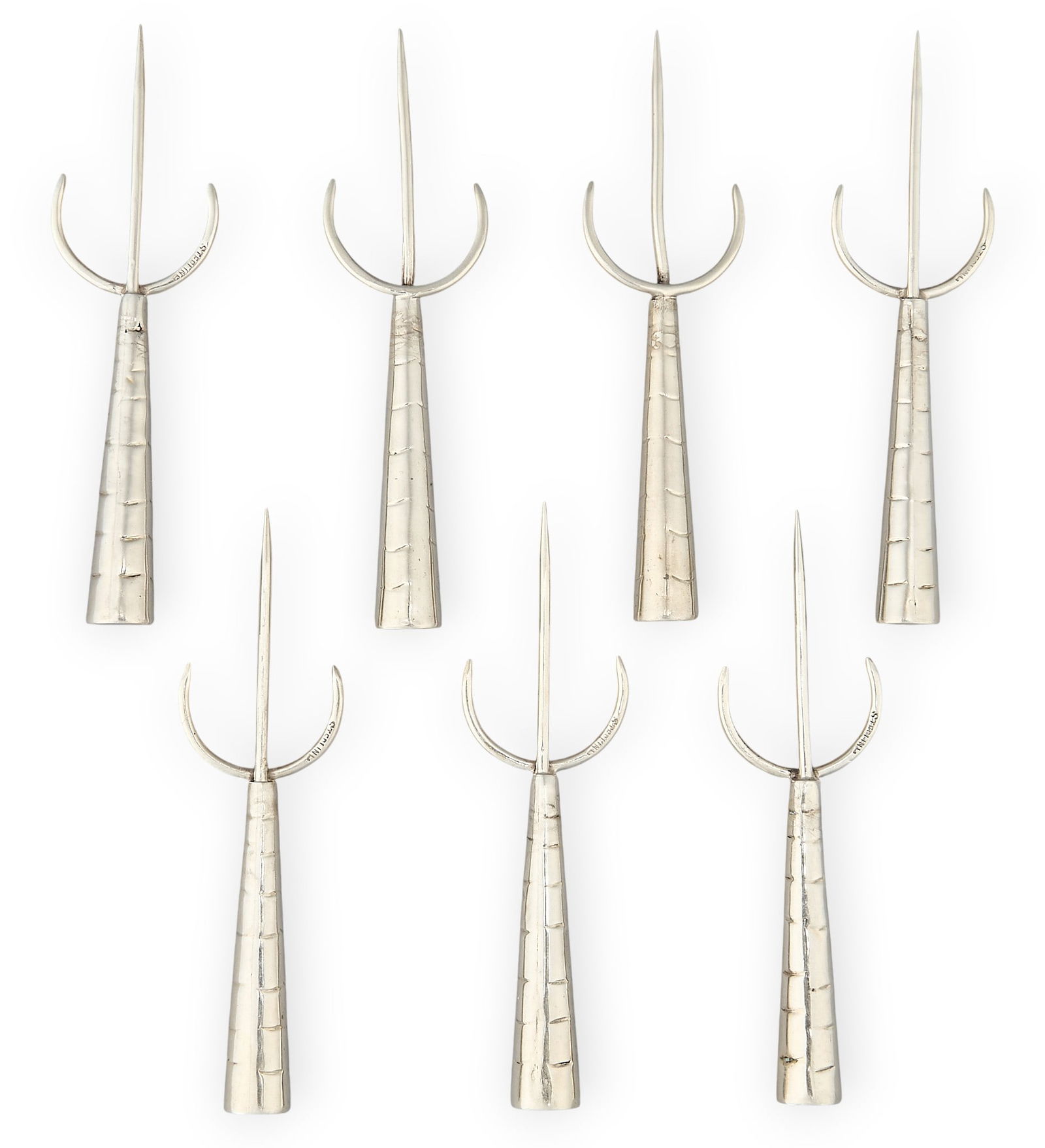 (7) Sterling Silver Hors D’oeuvres Forks: Set of seven sterling silver hors d’oeuvres forks/picksLength: 3.25 in. Total weight: 0.94 oztProvenance: Property from a home in San Antonio, Texas