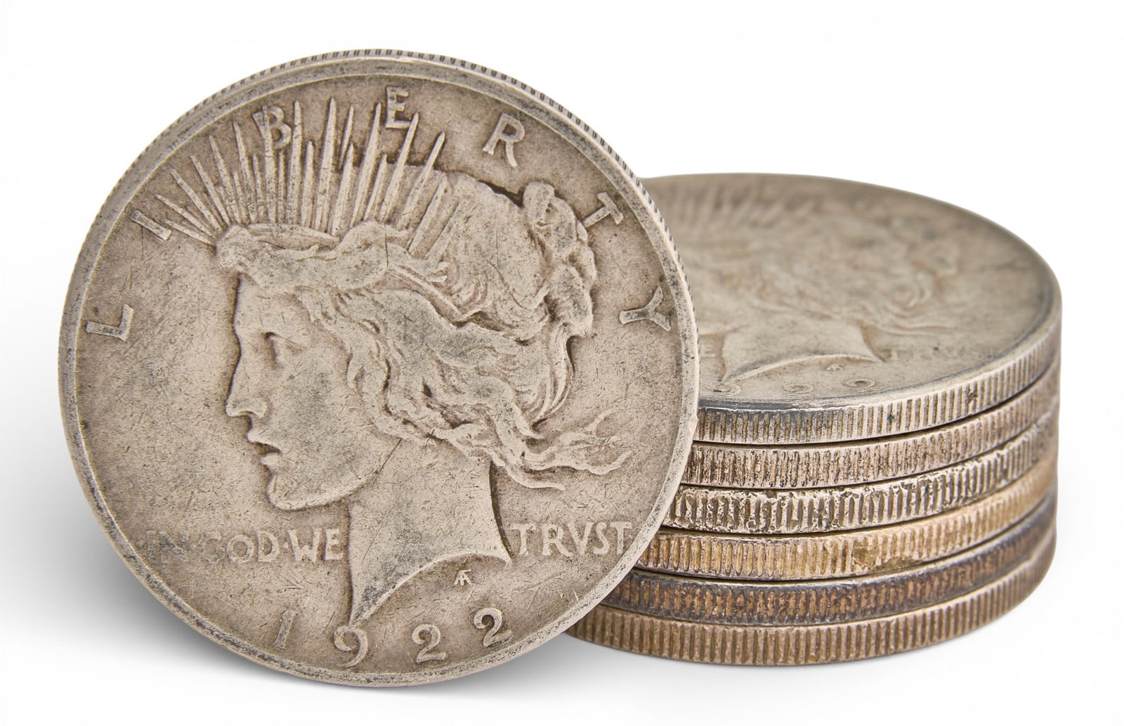 (7) Assorted Silver Peace Dollars: Seven assorted Morgan silver dollars, all 1922 Total weight: 5.985 ozt Provenance: Property from a home in San Antonio, Texas