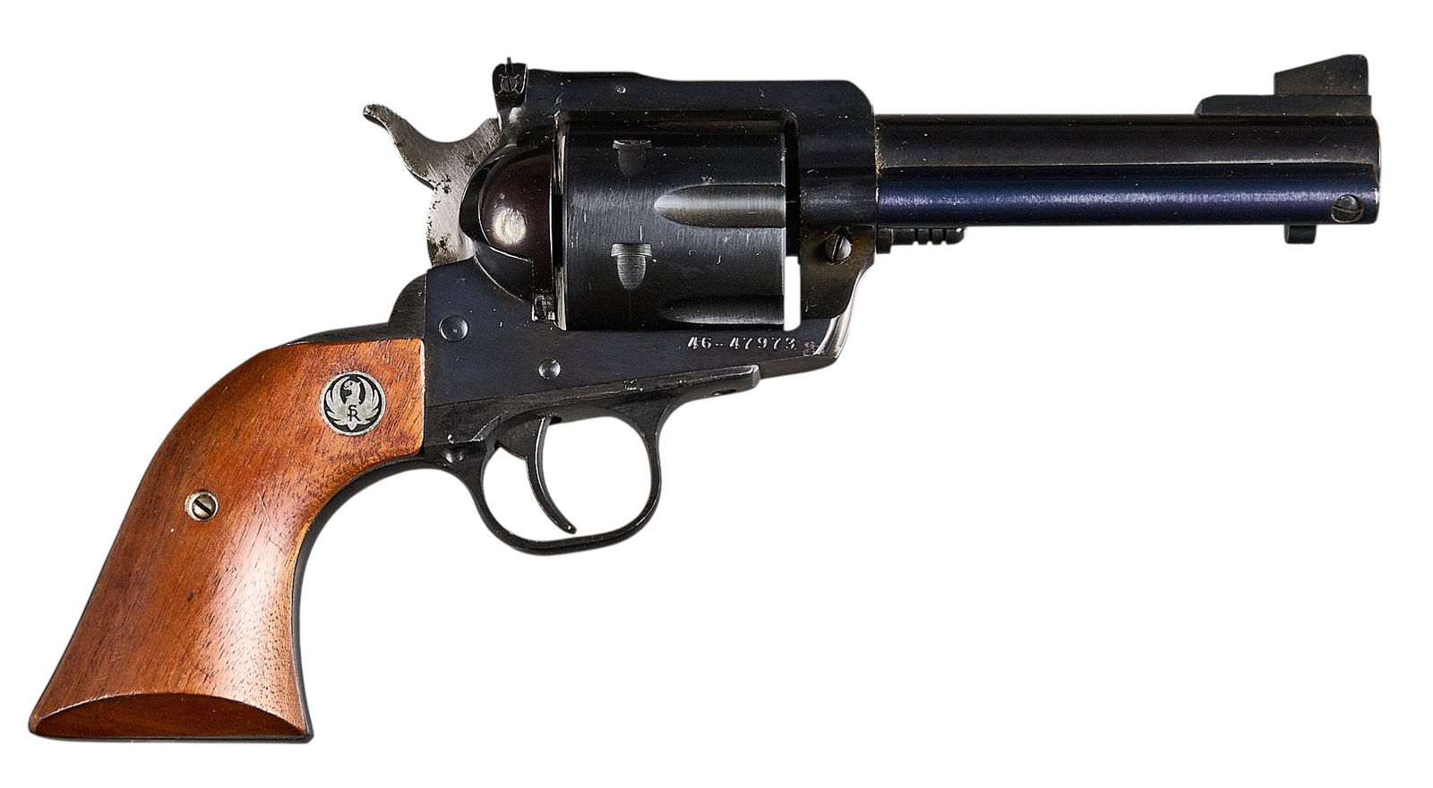 Ruger New Model Blackhawk 45 LC/ACP Revolver: Serial: 46-47973Manufacturer: Sturm, Ruger & Co.Model: New BlackhawkCaliber: 45 LC / 45 ACPBarrel length: 4.75 in.OAL: 10.75 in.Condition: Good; wood grips have light wear; barrel, frame & cyl