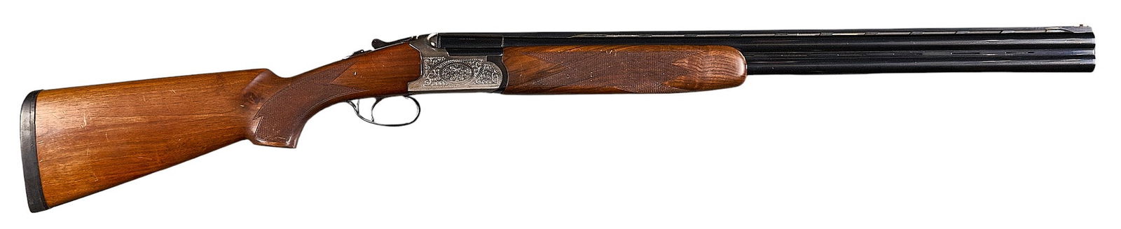 Spanish Lanber 12 Gauge Over Under Shotgun: Serial: 279797Manufacturer: Lanber Armas-SpainModel: O/UCaliber: 12 GaugeBarrel length: 27.5 in.OAL: 44.5 in.LOP: 14.25 in.Condition: Good; wood stock & forend have moderate wear & scratches;