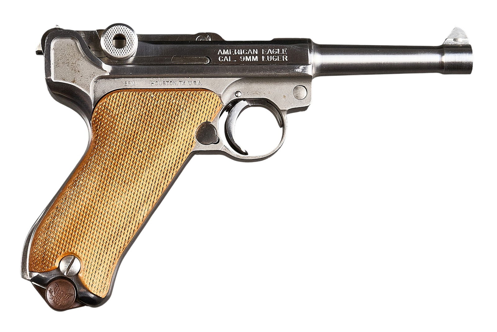 SPM American Eagle Luger 9mm Semi Auto Pistol: Serial: 8587Manufacturer: SPM (c. 1993)Model: American Eagle LugerCaliber: 9mmBarrel length: 4 in. OAL: 8.5 in.Condition: Good; wood grips have slight handling marks; light wear & scratc