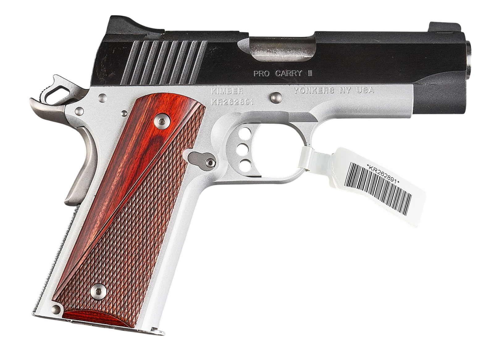 Kimber Pro Carry II 45 ACP Semi Auto Pistol: Serial: KR262891Manufacturer: Kimber - Yonkers, NYModel: Pro Carry IICaliber: 45ACPBarrel length: 3.75 in.OAL: 7.5 in.Condition: Very Good; some very light wear & handling marks; dried factory gre