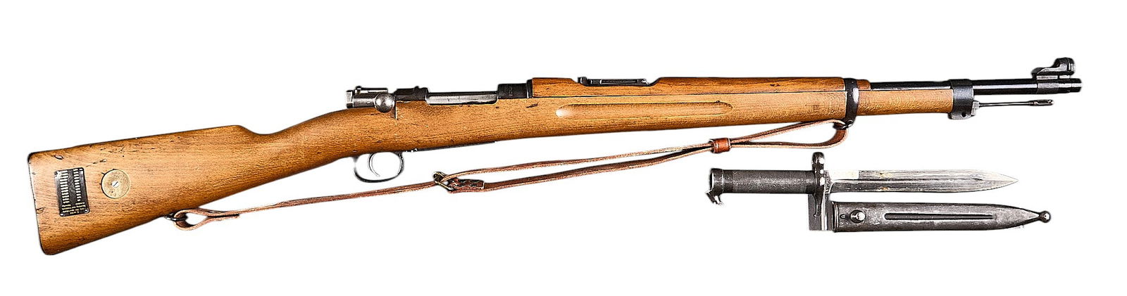 Swedish Carl Gustafs M38 6.5x55 Bolt Action Rifle W/ Bayonet: Serial: 65403Manufacturer: Carl Gustafs Stads Gevarsfaktori-Sweden (c. 1900)Model: M38Caliber: 6.5x55 SwedishBarrel Length: 24 in.OAL: 44 in.Condition: Good; wood stock has mostly light wear w/ a repa