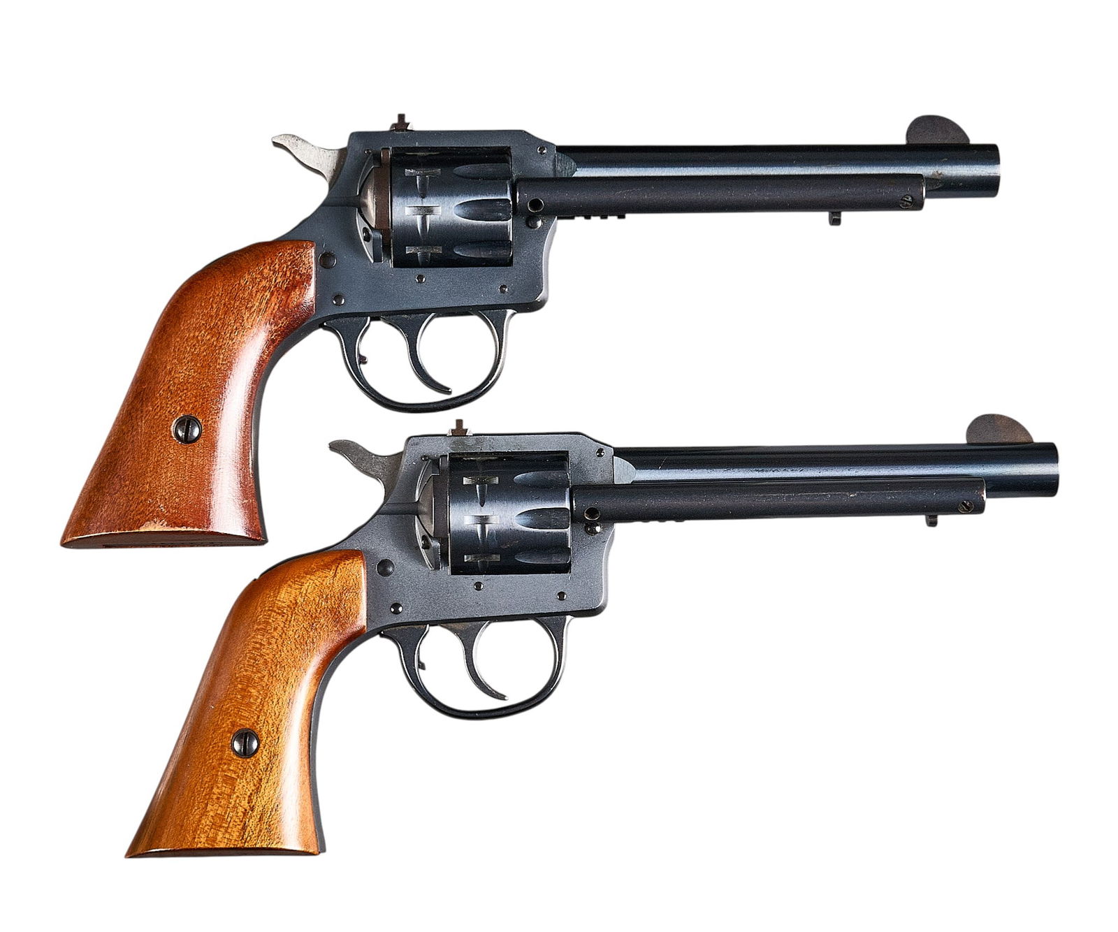 Pair of H&R Model 949 22 LR Revolvers in Box: Serial: (1) AN16241; (2) AP141429Manufacturer: H&R Inc.Model: 949Caliber: 22 LRBarrel length: 5.5 in.OAL: 10.5 in.Condition: (1 & 2) Very Good; light used condition; bore is excellent & br