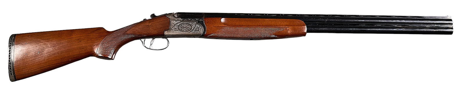 Spanish Lanber Sporter 12 Gauge Over Under Shotgun: Serial: 169899Manufacturer: Lanber-SpainModel: Sporter O/UCaliber: 12 GaugeBarrel length: 27.5 in.OAL: 44.5 in.LOP: 14.125 in.Condition: Good; wood stock & forend have light wear & scratc