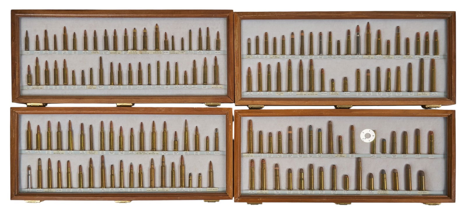 Outstanding 4 Case Set of US Rifle Cartridges: Includes: cartridge displays in cases w/ labels on the reverse-(1) US Rifle Cartridge display: 42 cartridges from 17 Rem to 257 Weatherby Mag-(2) US Rifle Cartridge display: 37 cartridges from 264 Win