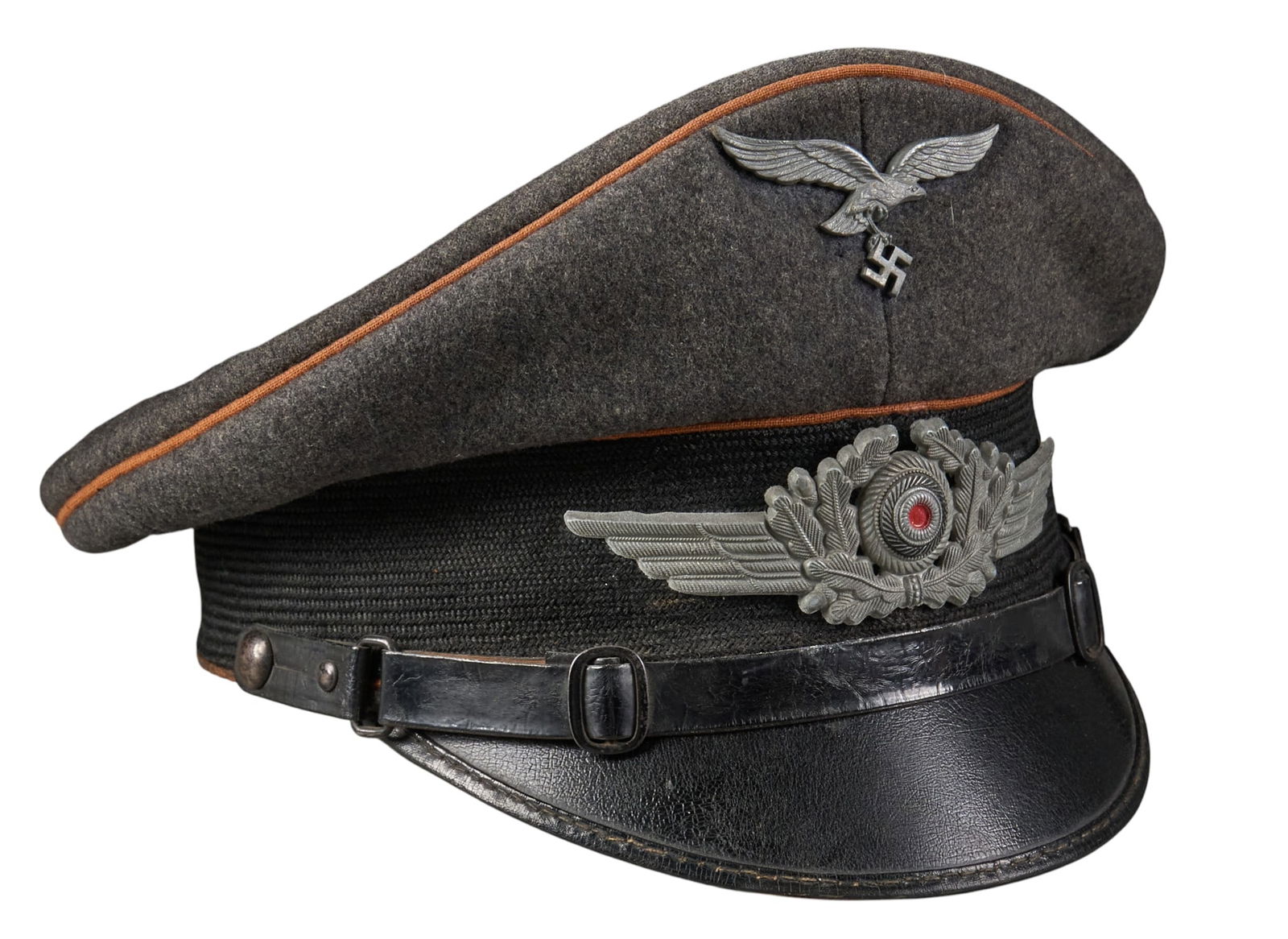 WWII German Luftwaffe EM Signal Visor Cap: WWII German Luftwaffe EM signal visor capIncludes: -aluminum oak leaf wreath w/ wings around cockade-aluminum Luftwaffe eagle insignia pin-metal "B" pin on sweat bandProvenance: An