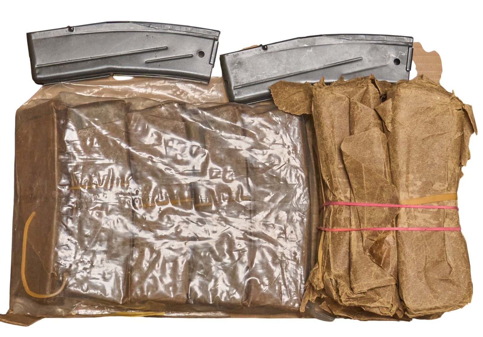 Collection of 20 30-Round M1 Carbine Magazines: Includes: collection of 20 30-rd M1 Carbine magazines-9 are individually wrapped in wax paper-9 are wrapped in packs w/ wax paper-2 are looseAll in goose vintage conditionProvenance: A Castle Hills, T