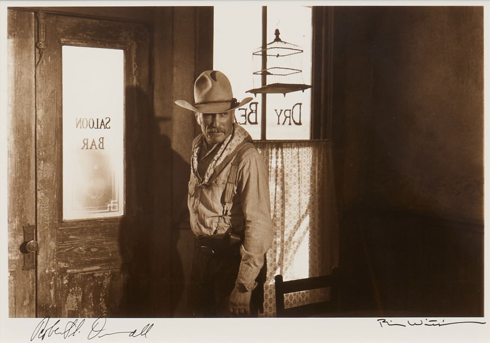 Bill Wittliff, "Gus in the Dry Bean": Bill Wittliff (Texas, 1940-2019), "Gus in the Dry Bean", signed by both Robert Duvall and Bill Wittliff, photograph, silver gelatin print, framed and matted by John Scott (Austin, Texas