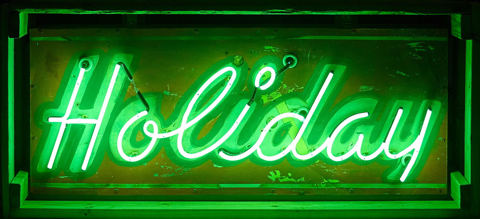 Factory Original Holiday Neon Sign: Holiday neon sign with factory original skin and neon lettering, in working conditionheight 24 in. x width 60 in. x depth 9 in. Provenance: Property from a home in San Antonio, Texas 