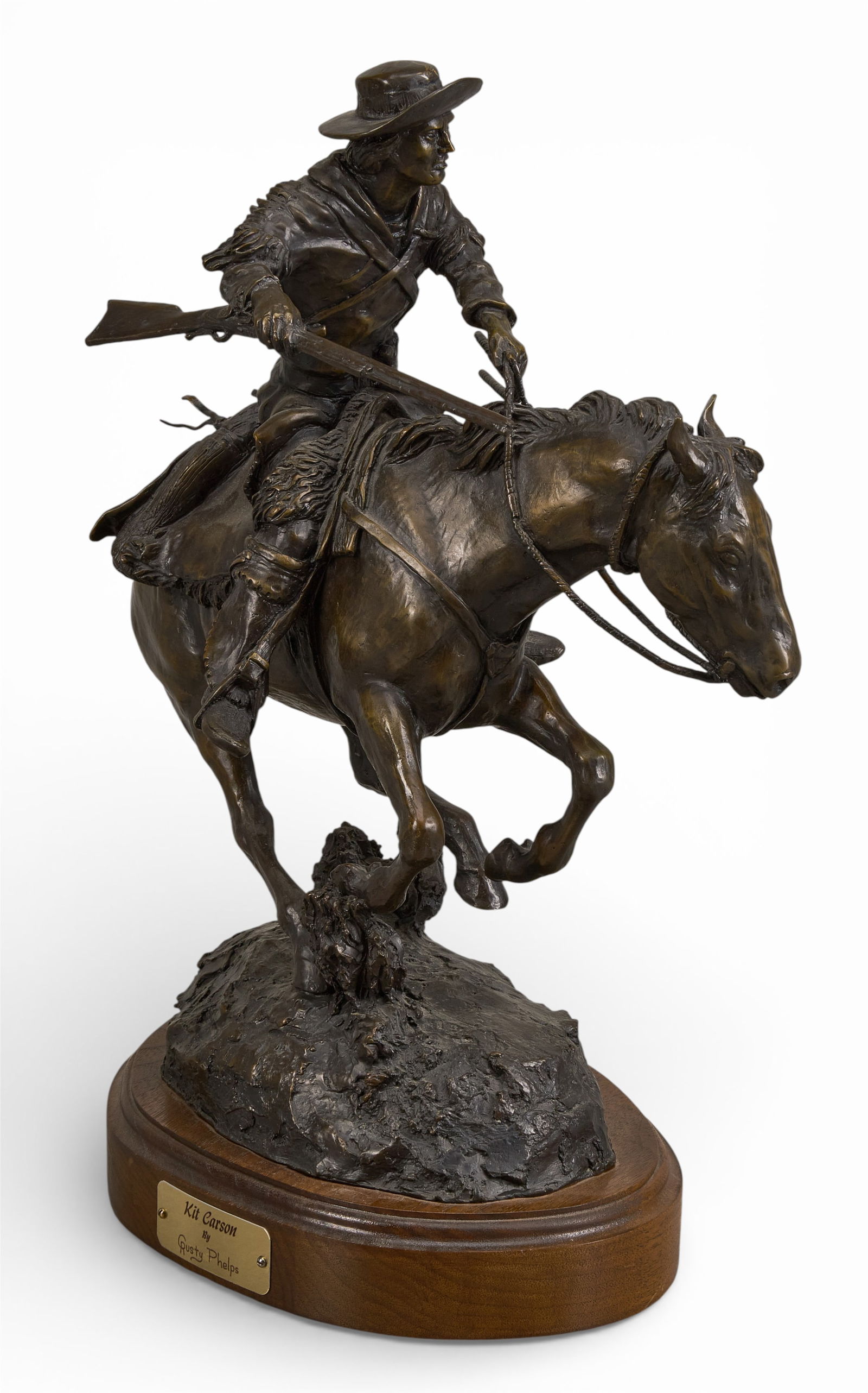 Rusty Phelps, "Kit Carson": Rusty Phelps (Amer., b. 1936), "Kit Carson", artist-cast bronze sculpture on wooden base, incised signature and edition number, 8/60, incised date, 1999height 17.5 in. x width 16 in. x