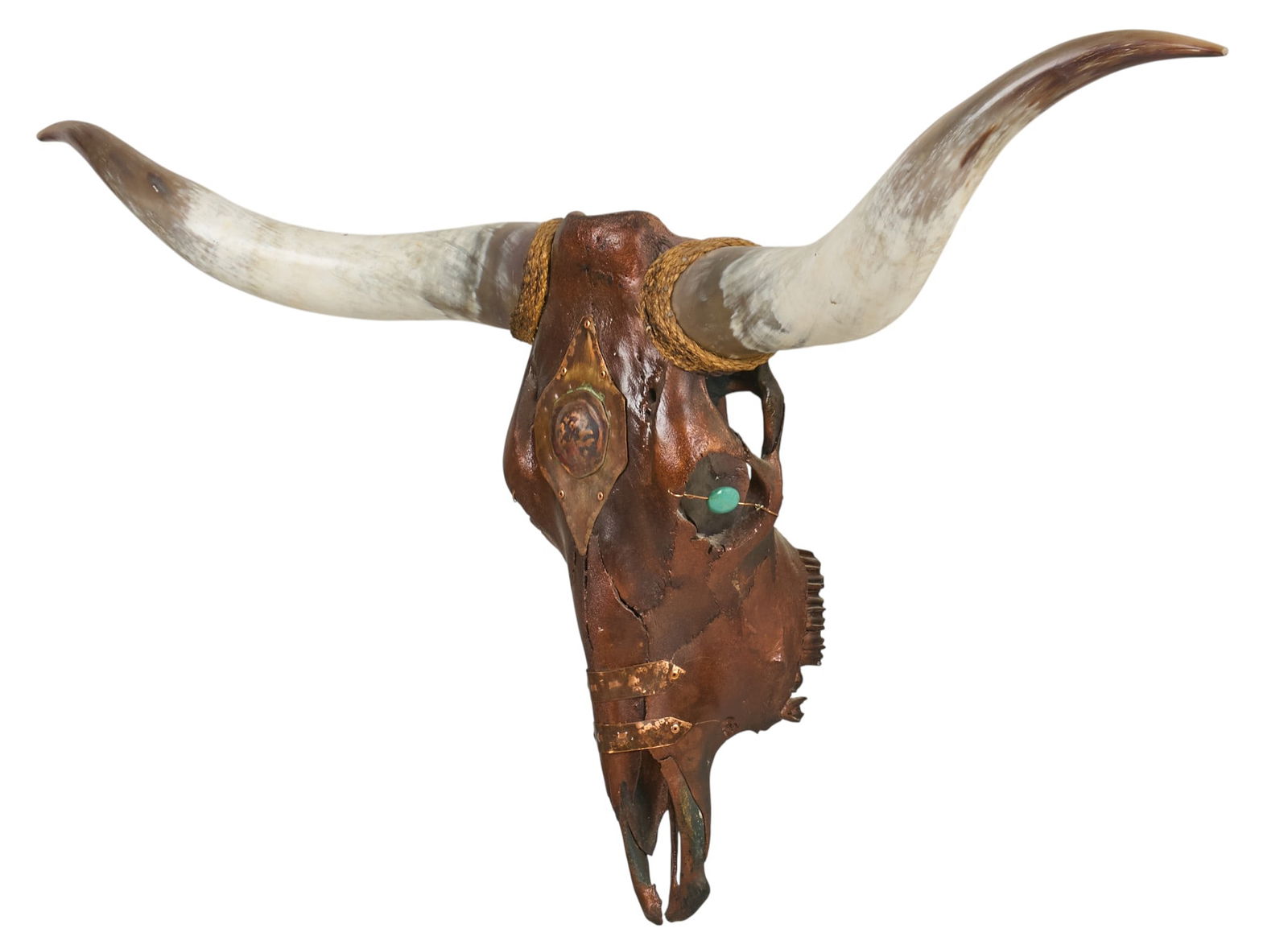 Mounted Steer Skull: Mounted steer skull with longhorns, decorated with metal accents and turquoise details height 26 in. x width 52 in. x depth 10 in. Provenance: Property from a home in Ingram, Texas