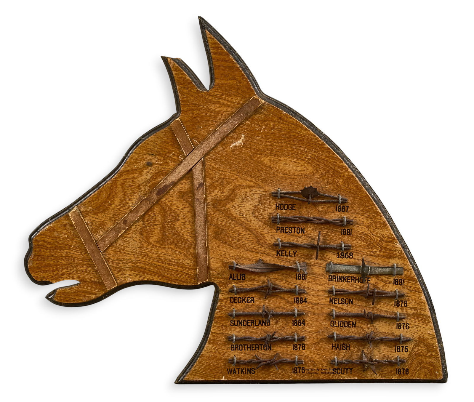 Horse Head Barbed Wire Display: Barbed wire display with various labeled patterns mounted to board with shape of horse head height 16 in. x width 19 in. x depth 1 in. Proveance: Property from a home in San Antonio, Texas