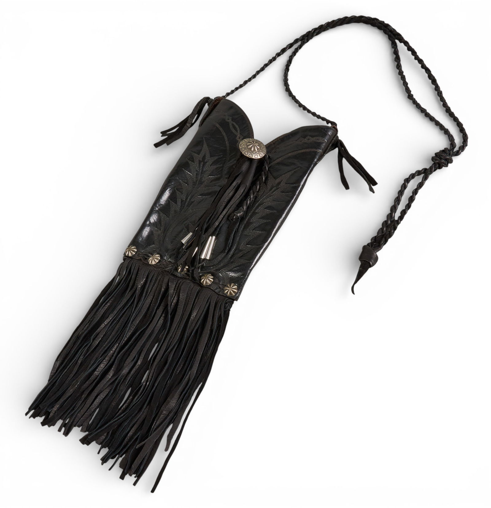 Black Leather Boot Bag: Western style custom-made shoulder bag made from black leather boot with stitched details, with silver metal conchos, braided leather strap, and fringe detailoverall length: 47 in. (including