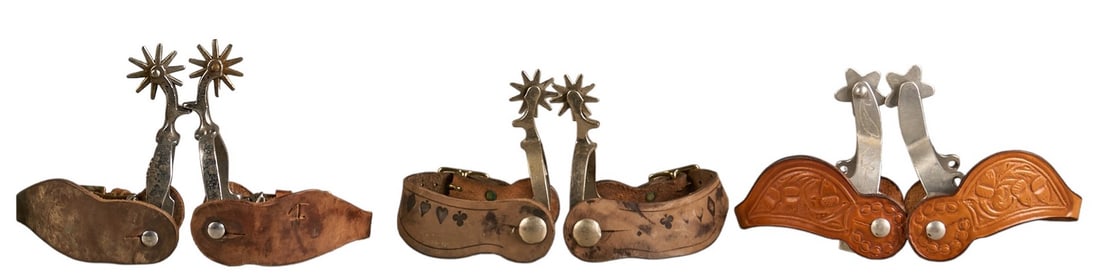 (3) Pairs of Cowboy Spurs: Three pairs of contemporary cowboy spurs with leather heel straps, with one pair having stamped card suite motifs on heel strapLength: 6.25 in. / largest pair Heel width: 3 in. /
