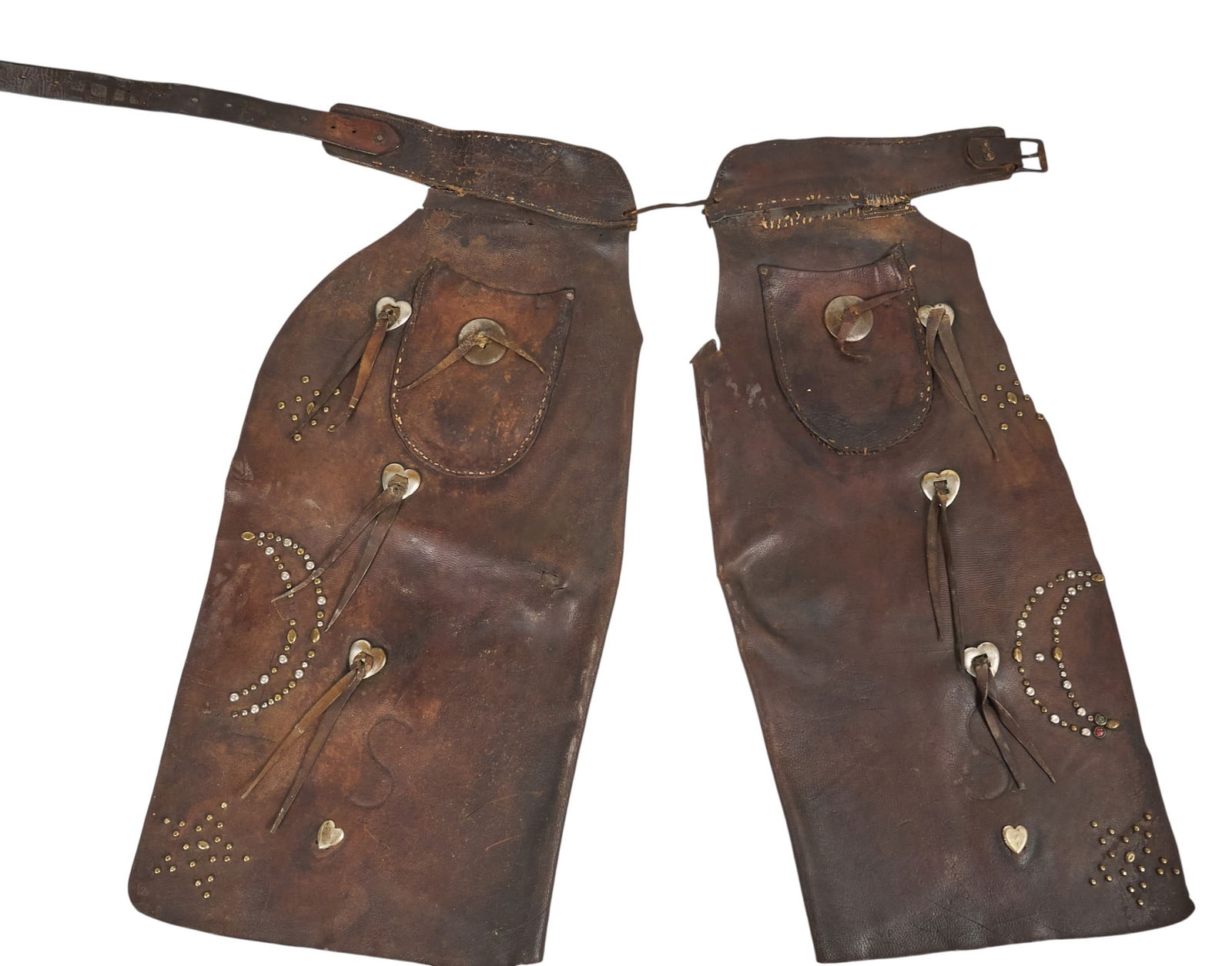 Studded Batwing Chaps with Moon and Star Motifs: Pair of brown leather batwing chaps, decorated with silver and gold-tone studs forming moon and star motifs, with pockets and fringe detailsheight 33 in. x width 46 in. x depth 2 in.Provenance:
