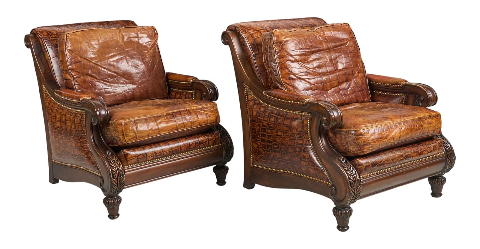 (2) Hancock & Moore Leather Chairs: Pair of Hancock and Moore armchairs with crocodile print leather, supported on turned legs height 38 in. x width 31 in. x depth 43 in. Provenance: Property from a home in San Antonio, Texas
