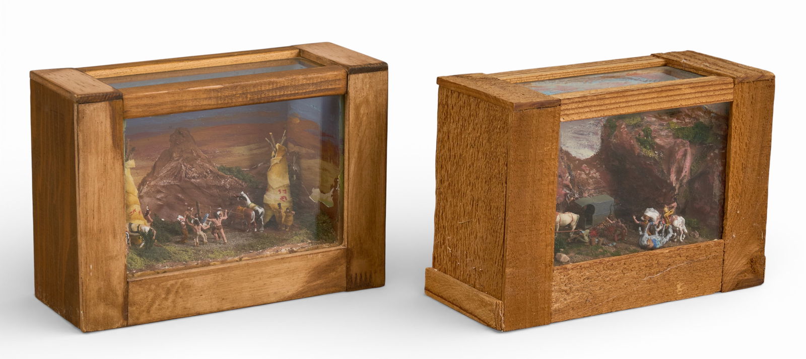 Pair of Bailey Western Diaramas: Two Western folk art dioramas, signed "Bailey '81", with one titled "Striking the Pole," the other "Guns for Apache Gold", each depicts a scene with figures and