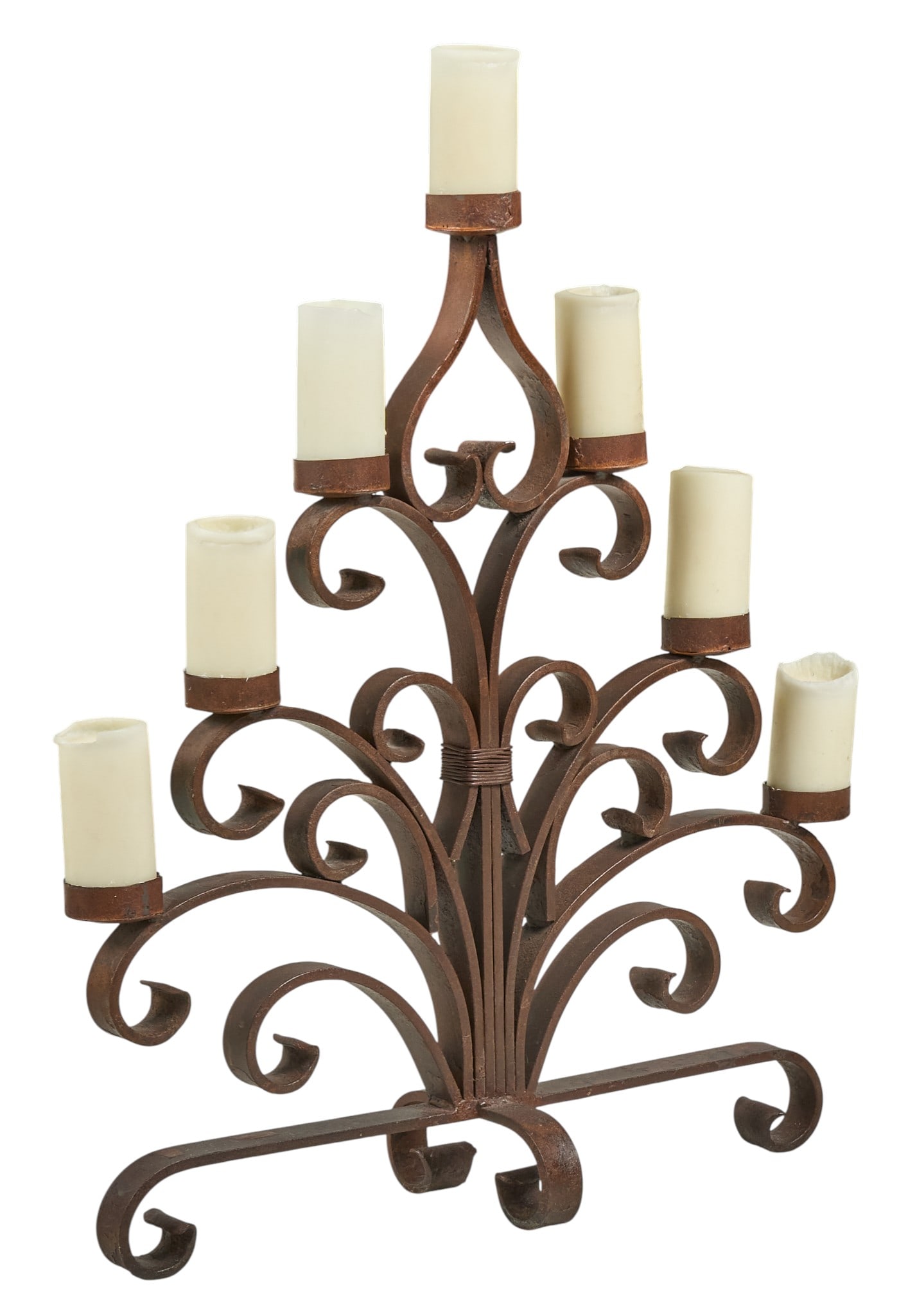 Wrought Iron Candelabra: Wrought iron candelabra, with seven arms and scrolled details, and white candlesheight 38 in. x width 30 in. x depth 9 in.Provenance: Property from a home in San Antonio, Texas