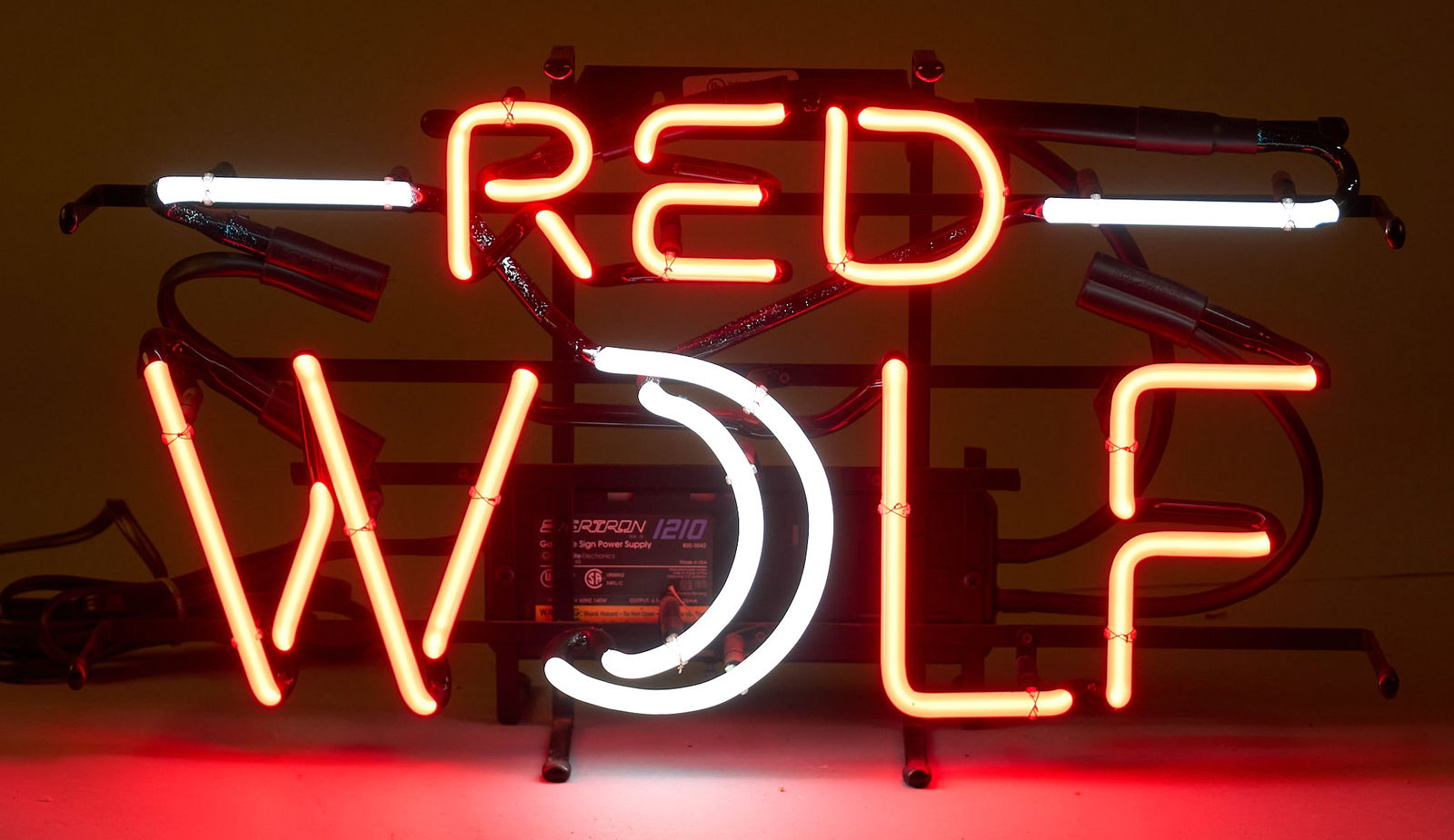 Red Wolf Neon Sign, 1995: Vintage Red Wolf neon sign, dated 1995 on back, in working conditionheight 10.5 in. x width 22 in. x depth 6.5 in. Provenance: Property from a home in San Antonio, Texas