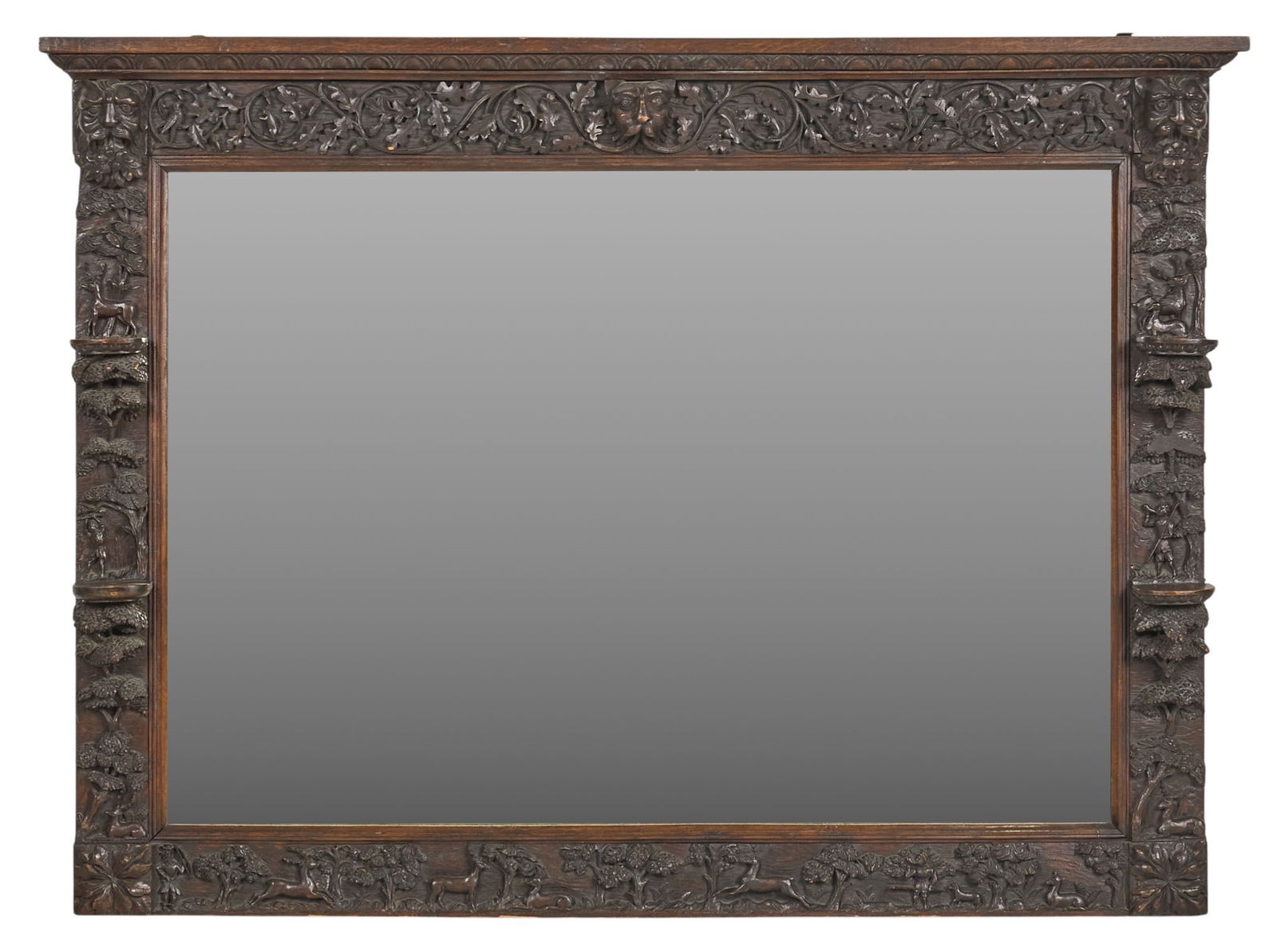 German Hunting Lodge Mirror: Antique German hunting lodge mirror in heavily carved frameheight 49 in. x width 67 in. x depth 5 in.Provenance: Property from the estate of a prominent San Antonio, Texas businessman