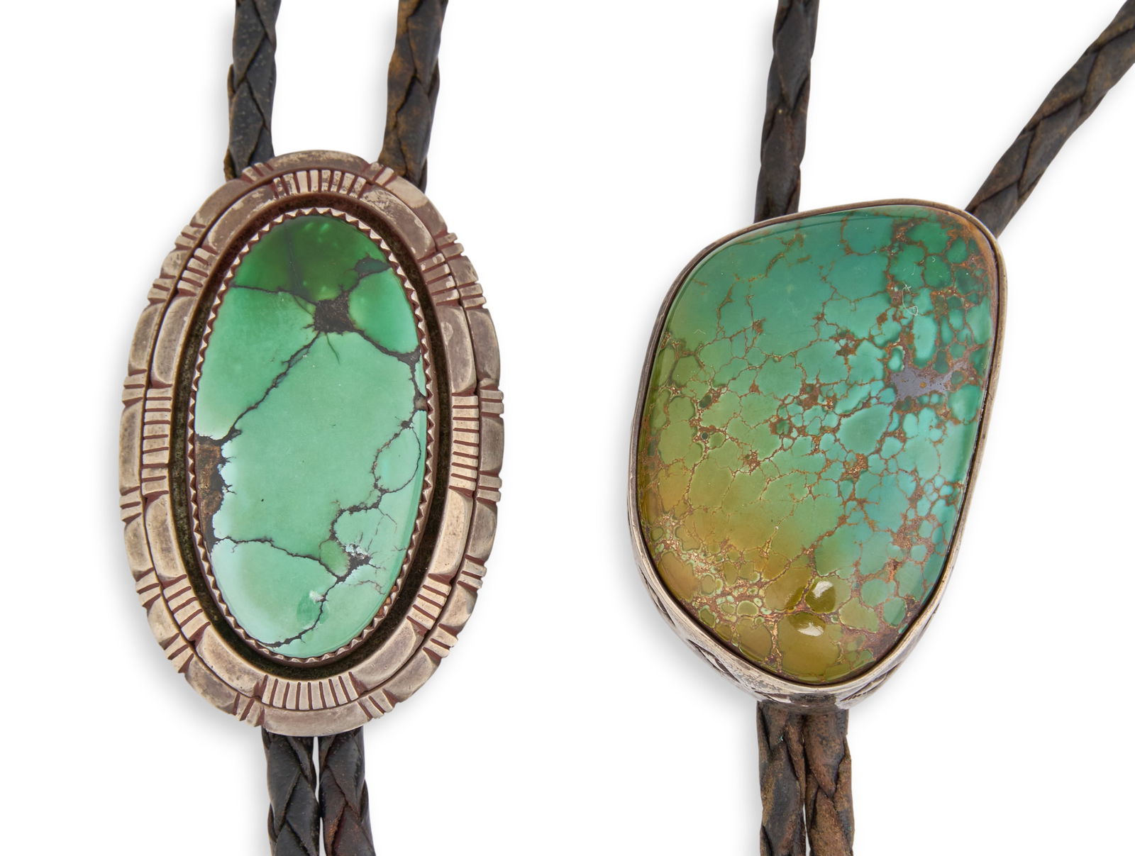 (2) Sterling & Turquoise Bolo Ties: Two sterling silver bolo ties, each set with single turquoise stone and featuring stamped details, on braided black leather cords, marked "Sterling" and "LC" Length: 38 in. / longe