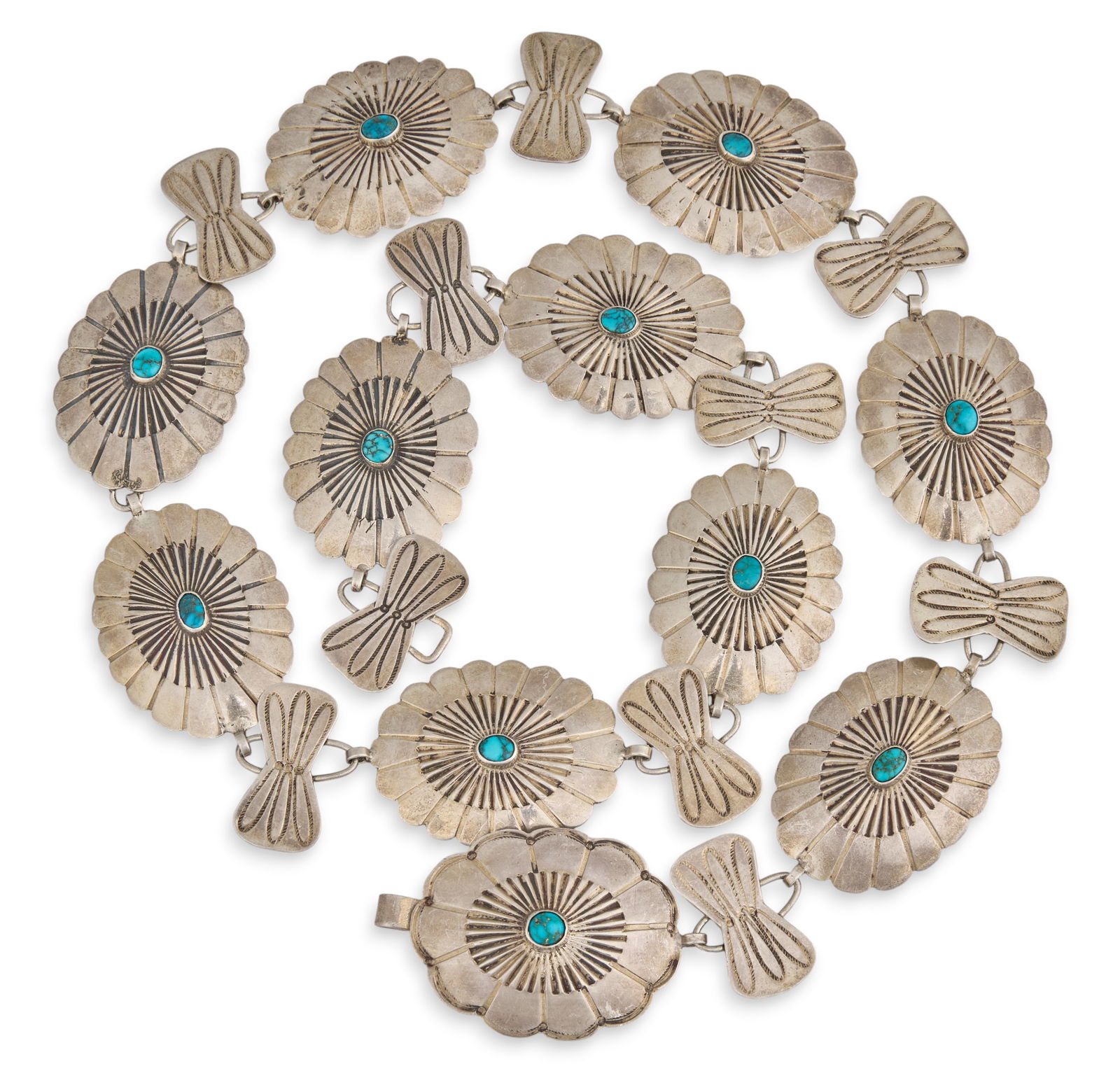 Sterling Silver & Turquoise Concho Belt: Sterling silver concho belt set with turquoise cabochons, with hook and eye closureLength: 30.25 in. Total weight: 4.99 oztProvenance: Property from the personal collection of a long-time Alamo