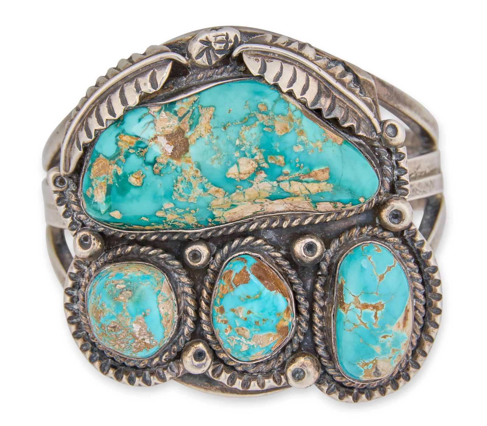 Navajo Sterling & Turquoise Cuff: Navajo sterling silver cuff bracelet, set with four turquoise stones, and featuring twisted rope and feather motifs, signed "JJM" (likely Julia Martinez) Circumference: 6.5 in.Total weight: