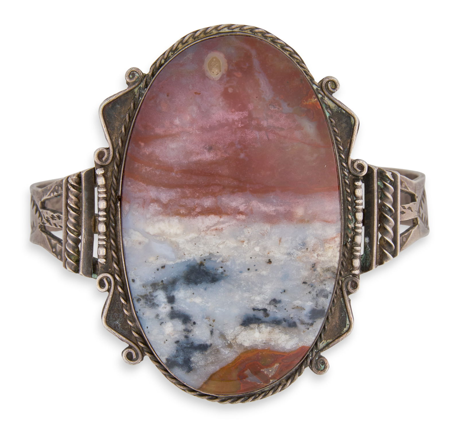 Pre-WWII Sterling & Agate Cuff: Pre-WWII sterling silver cuff bracelet with large oval agate stone, flanked by twisted rope and scrolled detailsCircumference: 7.5 in. Total weight: 1.795 oztProvenance: Property from a home in