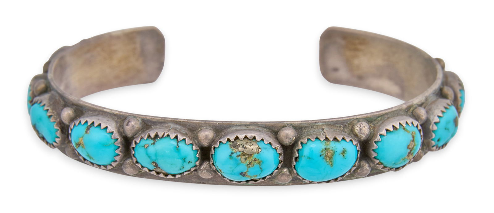 Sterling & Turquoise Cluster Cuff: Sterling silver and turquoise cluster cuff bracelet, marked "Sterling"Circumference: 6.5 in. Total weight: 0.665 oztProvenance: Property from a home in San Antonio, Texas