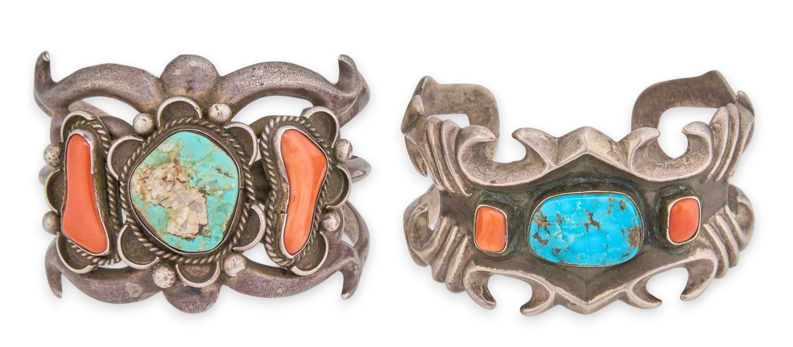 (2) Sterling Silver Turquoise & Coral Cuffs: Two Native American sterling silver cuff bracelets, each set with central turquoise stone and flanked by coral cabochons Circumference: 6.75 in. / largestTotal weight: 5.545 ozt Provenance: Property f