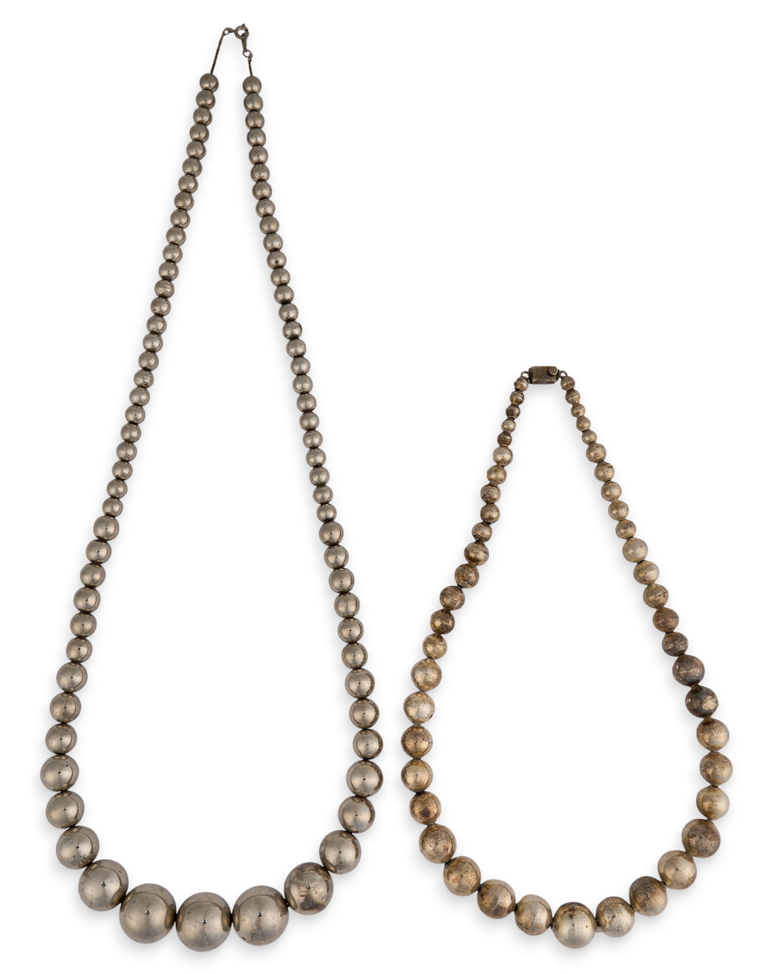 (2) Sterling Silver Beaded Necklaces: Two sterling silver beaded necklaces, with graduating round beads, both marked "925" Length: 31 in. / longestTotal weight: 4.35 ozt Provenance: Property from a home in San Antonio, Texas