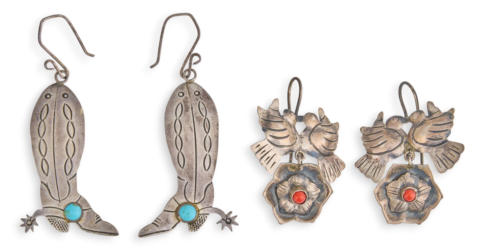 (2) Pairs of Western Sterling Earrings: Two pars of sterling silver earrings depicting Western motifs, set with round turquoise and coral cabochons, marked "925"Size: 1.75 in. x 1 in. / largest Total weight: 0.515 oztProvenance: