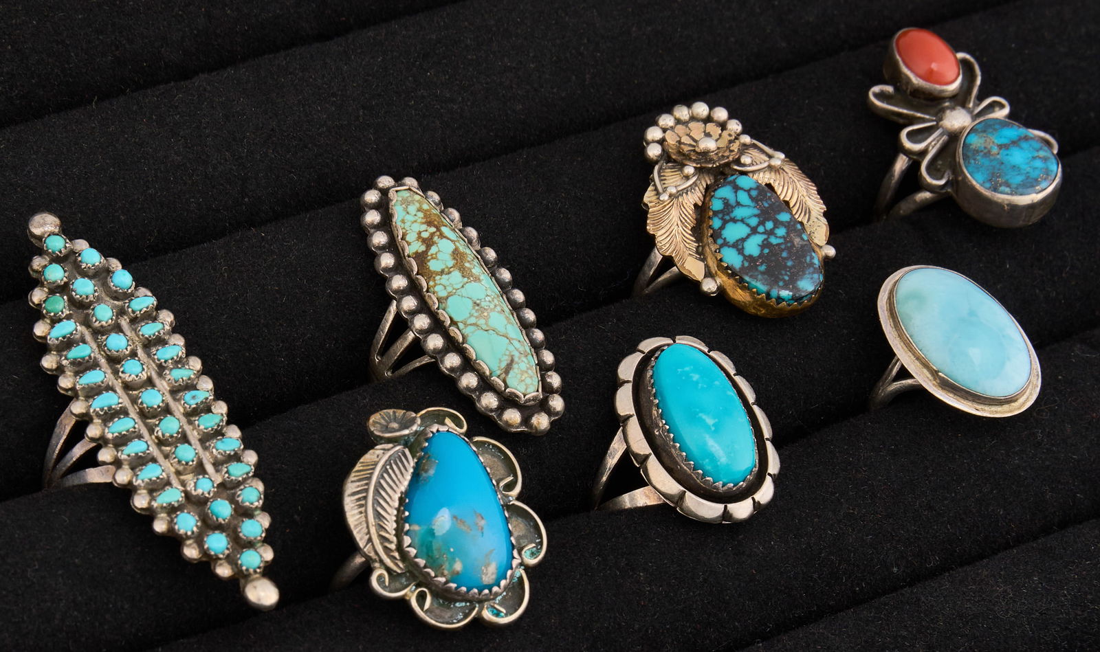 (7) Sterling & Turquoise Rings: Seven sterling silver rings in various sizes and styles, each set with turquoise cabochons in assorted settings, featuring Southwestern motifsSizes: 5-9 Total weight: 1.44 oztProvenance: