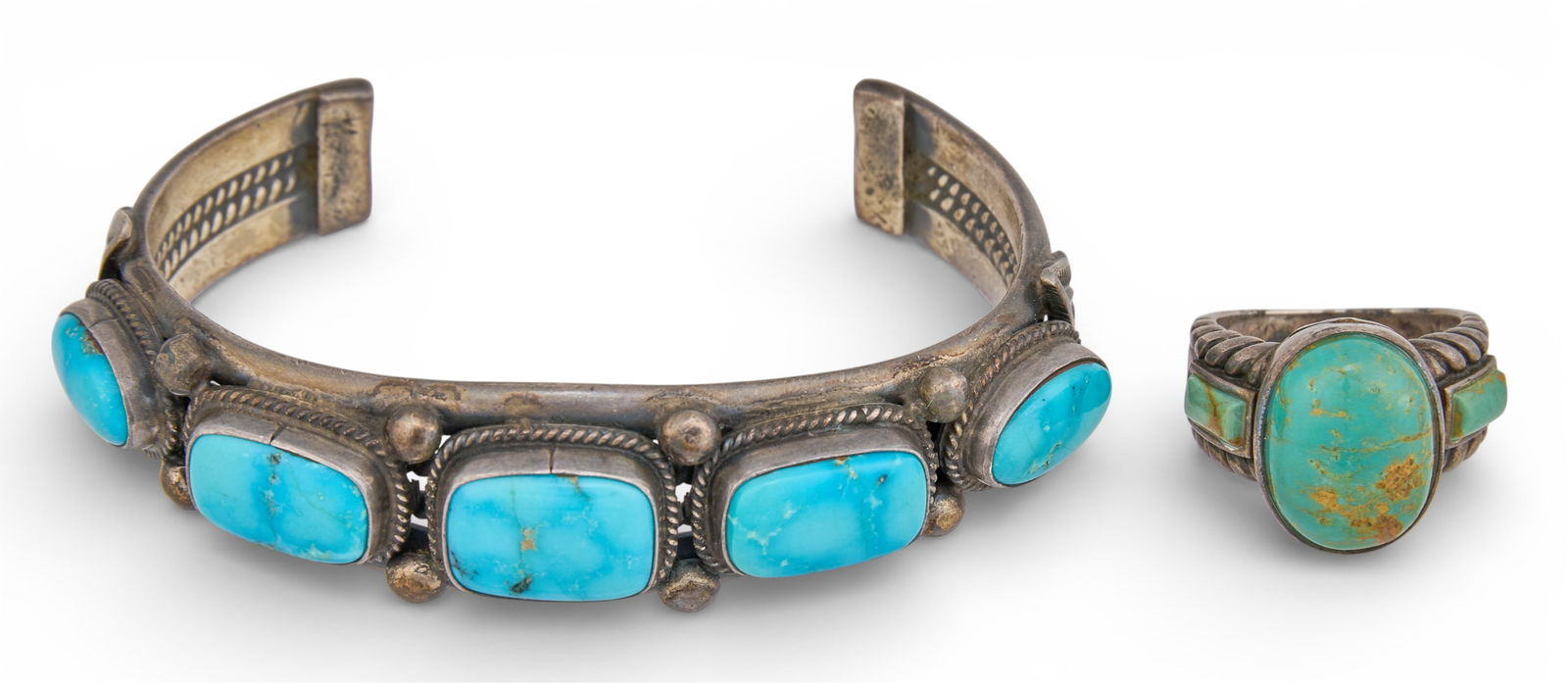 Sterling & Turquoise Ring and Cuff: Sterling silver cuff bracelet and ring, each set with turquoise cabochons, and featuring twisted rope motifs, cuff signed "Gloria Hill Sterling" and ring marked "925"Ring size: 5