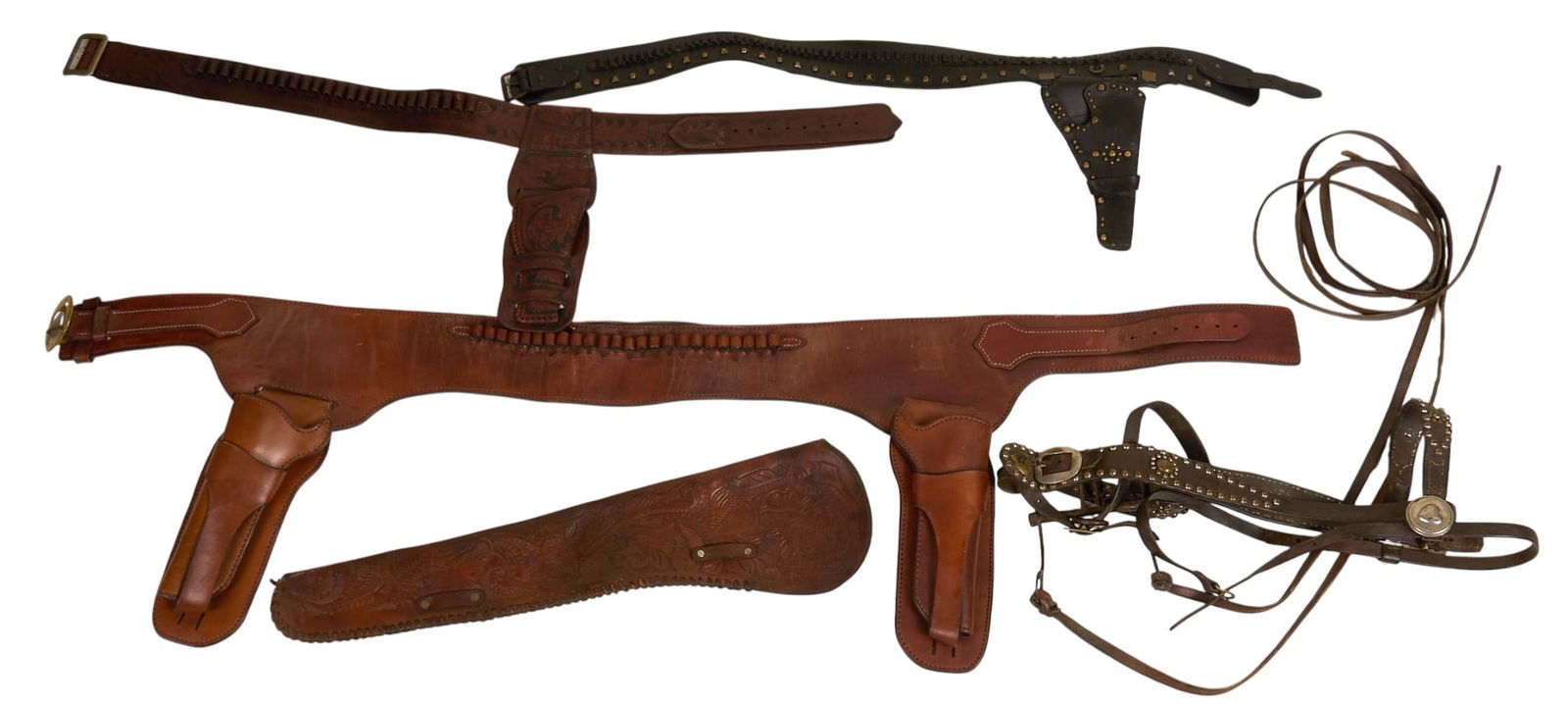 (5) Equestrian and Cowboy Items: Collection of five vintage equestrian and cowboy items including a tooled leather Heiser scabbard, a Buscadero rig gun holster belt for Colt Single Action, an extra-large double rig with jockstrap