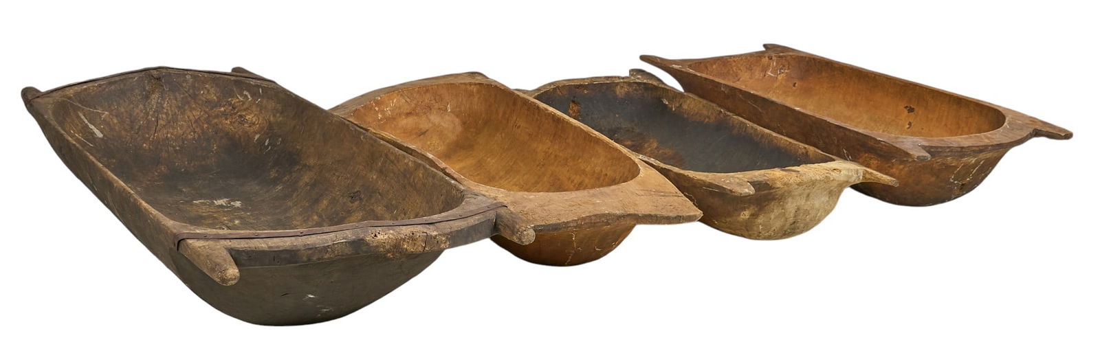 (4) Dough Troughs: Collection of four rustic wooden dough traysheight 12 in. x wdith 78 in. x depth 28 in. / largestProvenance: Property from a home in San Antonio, Texas