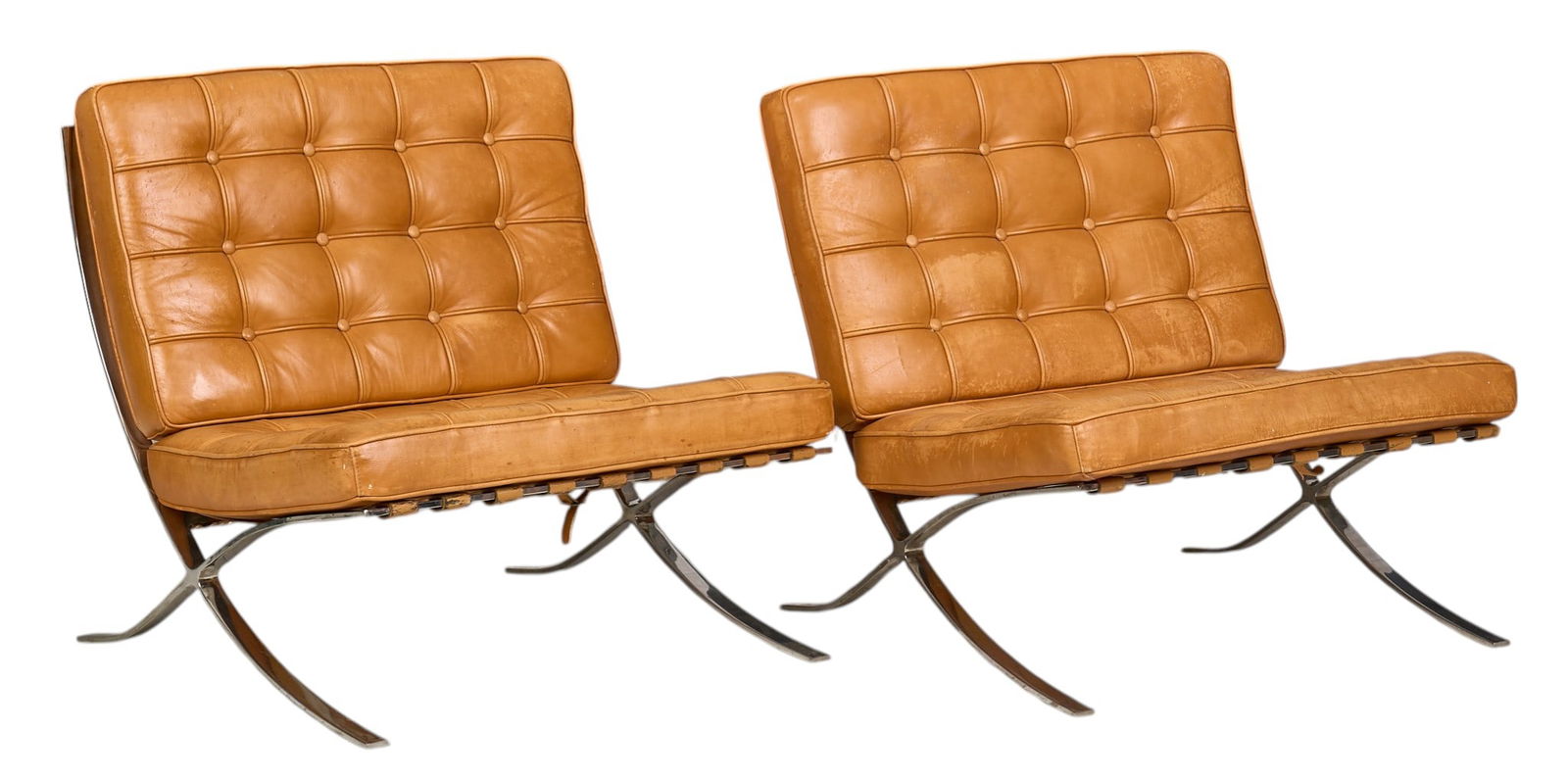 Pair of Barcelona Style Chairs: Pair of chairs in the style of the Barcelona model, designed by Ludwig Mies van der Rohe (1886-1969, Kingdom of Prussia / Germany), with light brown tufted leather upholstery, supported on steel