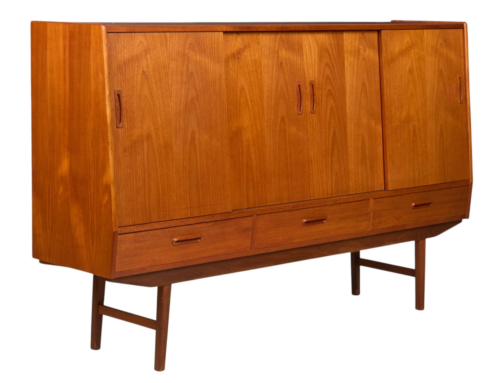 Danish Mid-Century Credenza: Danish mid-century credenza with four sliding doors, shelved interiors on left and right sides, and middle mirror-backed bar with curved shelves and three flatware drawers, above three bottom drawers,