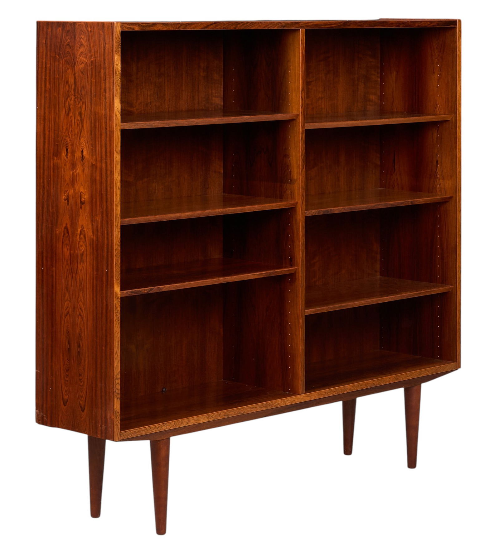 Danish Mid-Century Bookcase: Danish mid-century bookcase with six adjustable shelves, supported on pin legs height 51.5 in. x depth 54.5 in. x depth 12 in. 