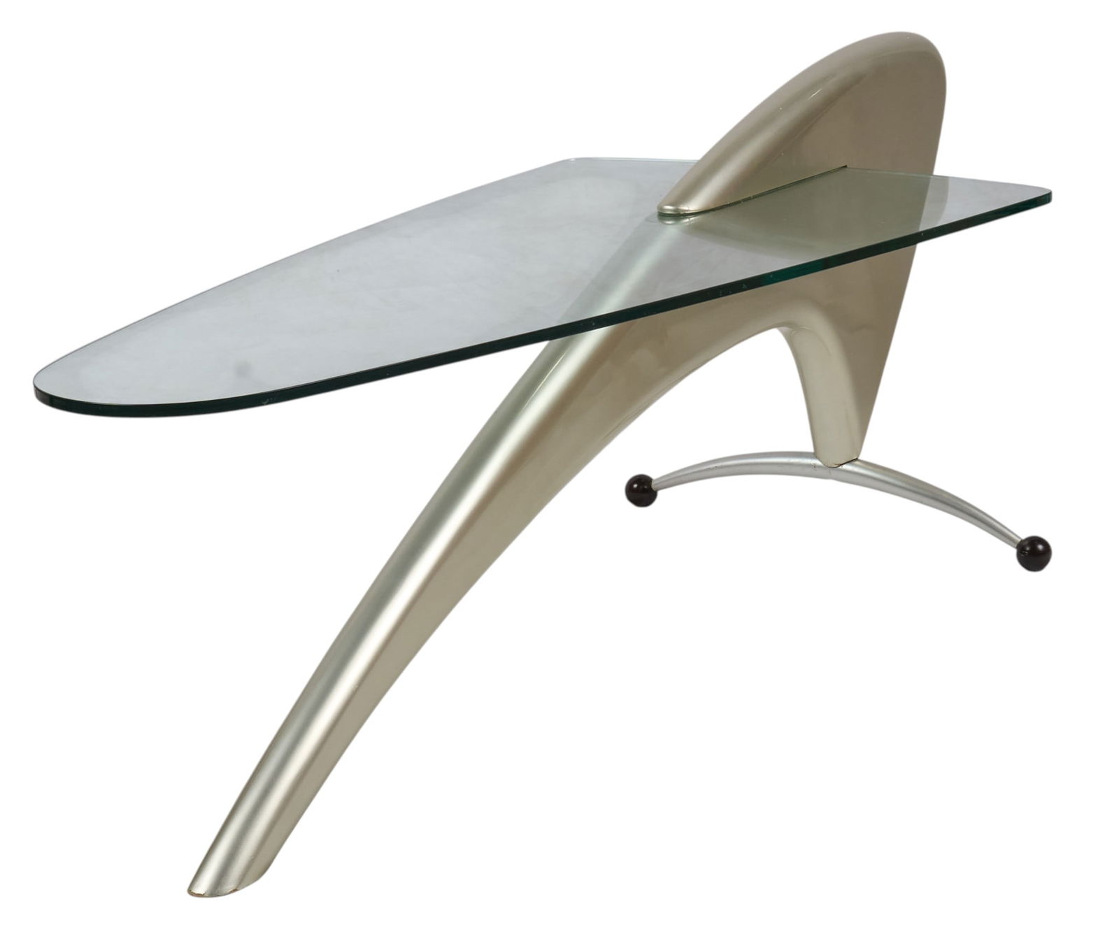 Retro Futurism Style Coffee Table: Retro Futurism style coffee table, with silver-toned fiberglass and glass top surfaceheight 21 in. x width 24 in. x depth 54 in.Provenance: Property from a home in San Antonio, Texas
